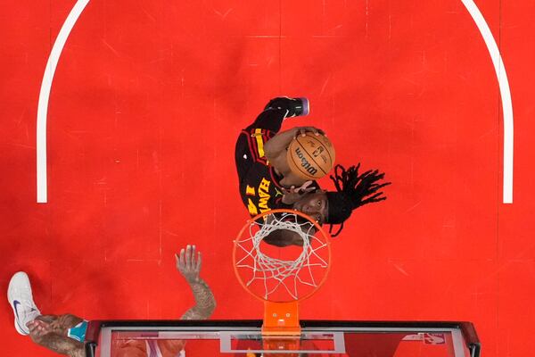 Charlotte Hornets forward Moussa Diabate (14) scores in the first half of an NBA basketball game against the Charlotte Hornets, Wednesday, March 12, 2025, in Atlanta. (AP Photo/Brynn Anderson)