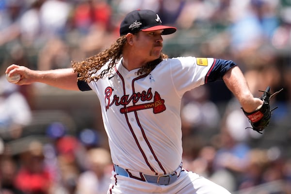 Atlanta Braves pitcher Grant Holmes (66) delivers against the Colorado Rockies in the second inning of a baseball game, Sunday, June 15, 2025, in Atlanta. (AP Photo/Mike Stewart)