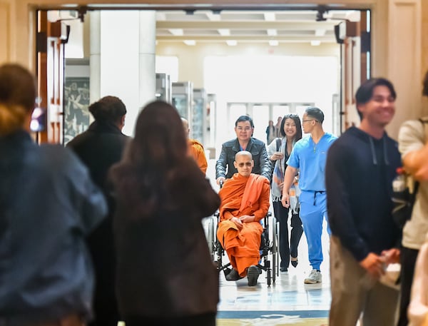 Buddhist monk Bhante Dam Phommasan, injured last fall in a cross-country "Walk for Peace," on his way into a meeting hall for a speaking engagement at Mercer University in Macon. (Jason Vorhees/The Macon Melody)