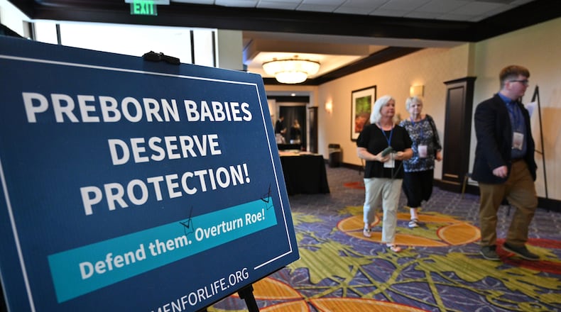 June 25, 2022 Atlanta - Attendees walk in a conference room during National Right to Life’s 51st convention at the Atlanta Airport Marriott Hotel in Atlanta on Saturday, June 25, 2022.(Hyosub Shin / Hyosub.Shin@ajc.com)