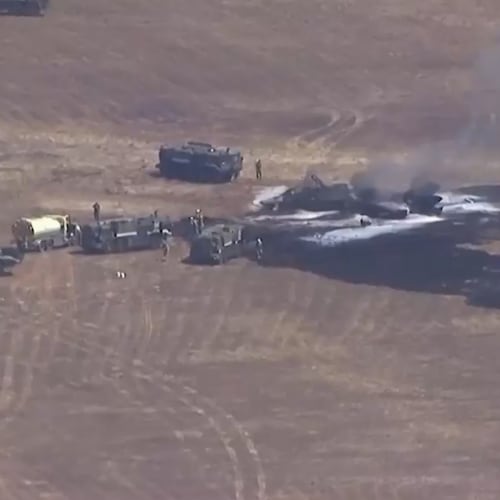 This image made from a video provided by KGTV shows the scene of an F-35 jet crash Friday, July 31, 2026, near the Miramar Air Base in San Diego. (KGTV via AP)