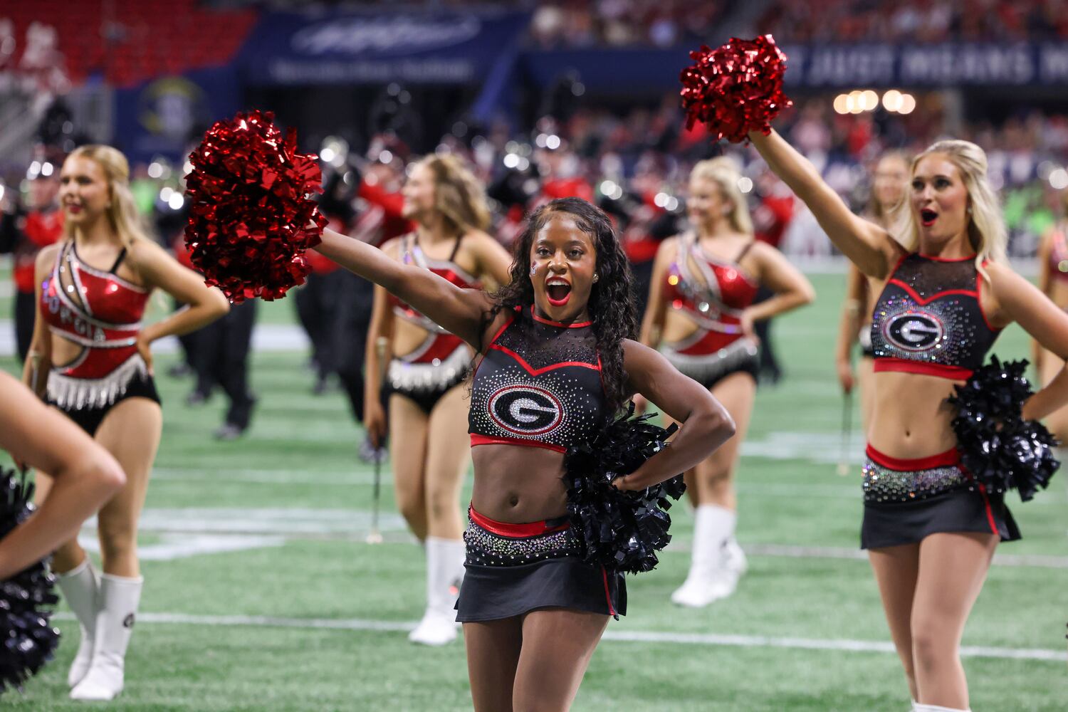 Georgia Bulldogs spirit team members perform against the Alabama Crimson Tide during the first half of the SEC Championship football game at the Mercedes-Benz Stadium in Atlanta, on Saturday, December 2, 2023. (Jason Getz / Jason.Getz@ajc.com)