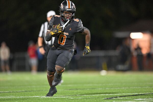 Kell running back Quinterrius “Moonie” Gipson carries the ball for a touchdown against Cambridge on Friday, Oct. 24, 2025, at Kell High School. (Daniel Varnado for the AJC)