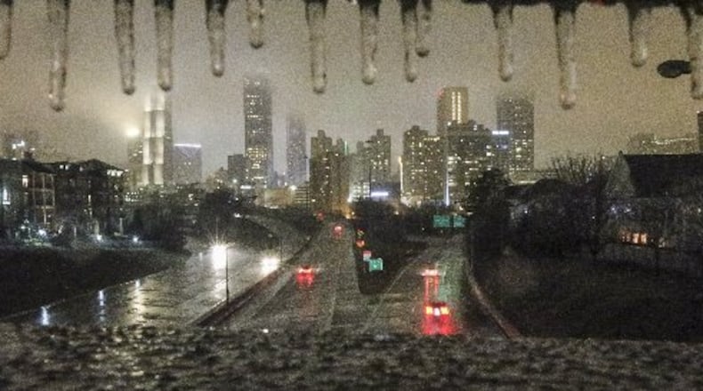 Ice hangs from the bridge rails of the Jackson Street bridge overnight as temperatures in metro Atlanta dropped. JOHN SPINK /JSPINK@AJC.COM