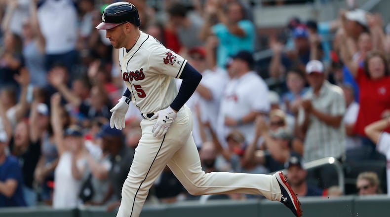 Atlanta Braves' Freddie Freeman rounds the bases after hitting a two-run home run in the first inning Sunday, Sept. 1, 2019, against the Chicago White Sox at SunTrust Park in Atlanta.