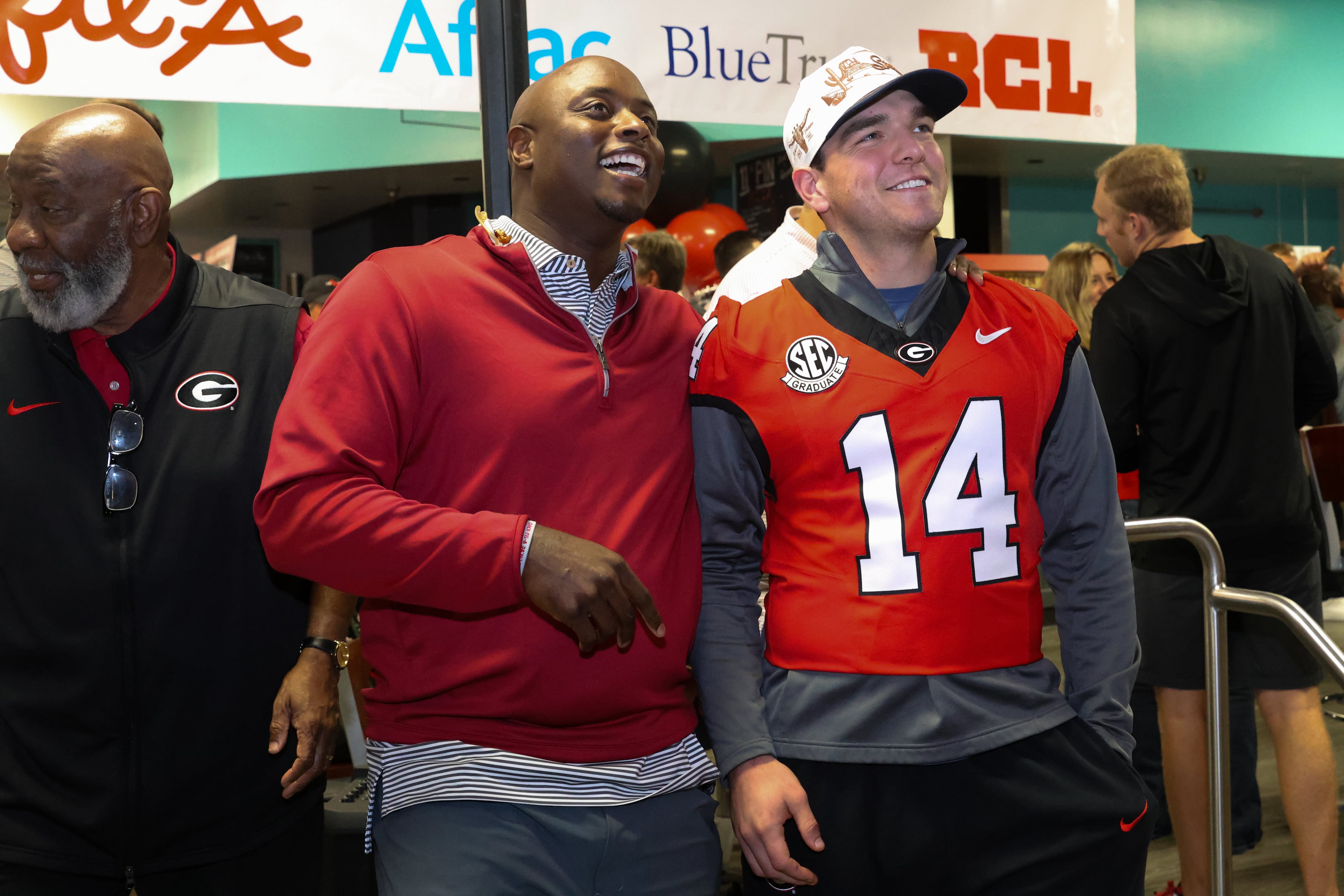 FOX 5 sports anchor and former UGA quarterback DJ Shockley (left) talks with current quarterback Gunner Stockton during the third annual Chick-fil-A Dawg Bowl fundraiser for Parkinson’s and Crohn’s disease research at Showtime Bowl in Athens on Wednesday, Oct. 22, 2025. (C.J. Bartunek for the AJC)