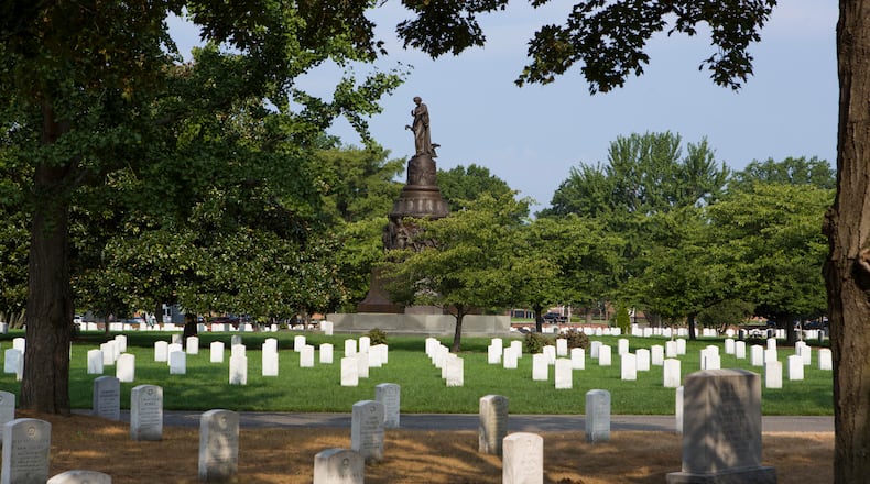 The monument in the Confederate section of Arlington National Cemetery has stood for more than a century. (Calla Kessler/The Washington Post)