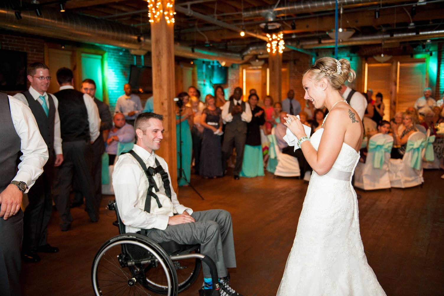 Paraplegic veteran surprises bride by standing for first dance