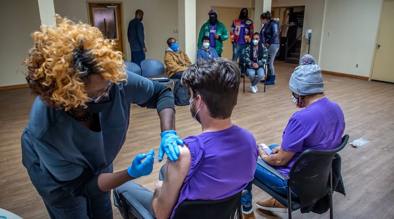 Vaccines, while not perfect, will reduce the chances you could transmit the virus to someone who can’t afford to get it. (Steve Schaefer for The Atlanta Journal-Constitution)