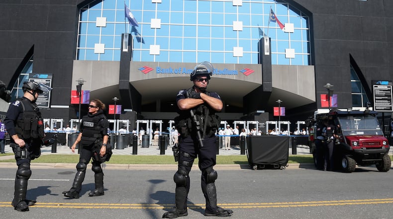 CHARLOTTE, NC - SEPTEMBER 25: Charlotte Mecklenburg Police Department officers deploy outside of Bank of America Stadium prior to the game between the Minnesota Vikings and Carolina Panthers at Bank of America Stadium on September 25, 2016 in Charlotte, North Carolina. Charlotte has been the site of civil unrest since Keith Lamont Scott, 43, was shot and killed by police officers at an apartment complex near UNC Charlotte. (Photo by Streeter Lecka/Getty Images)