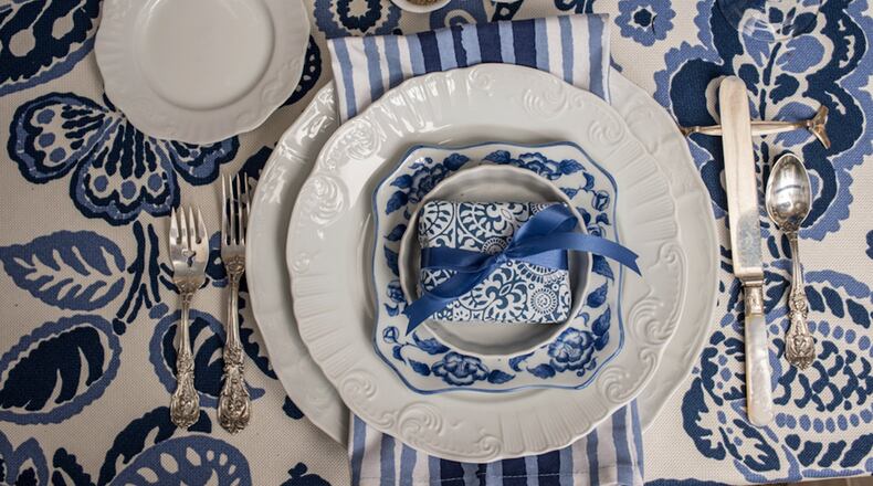 The place settings are super simple: everyday white plates topped with a sweet blue and white salad plate. (Mary Carol Garrity)