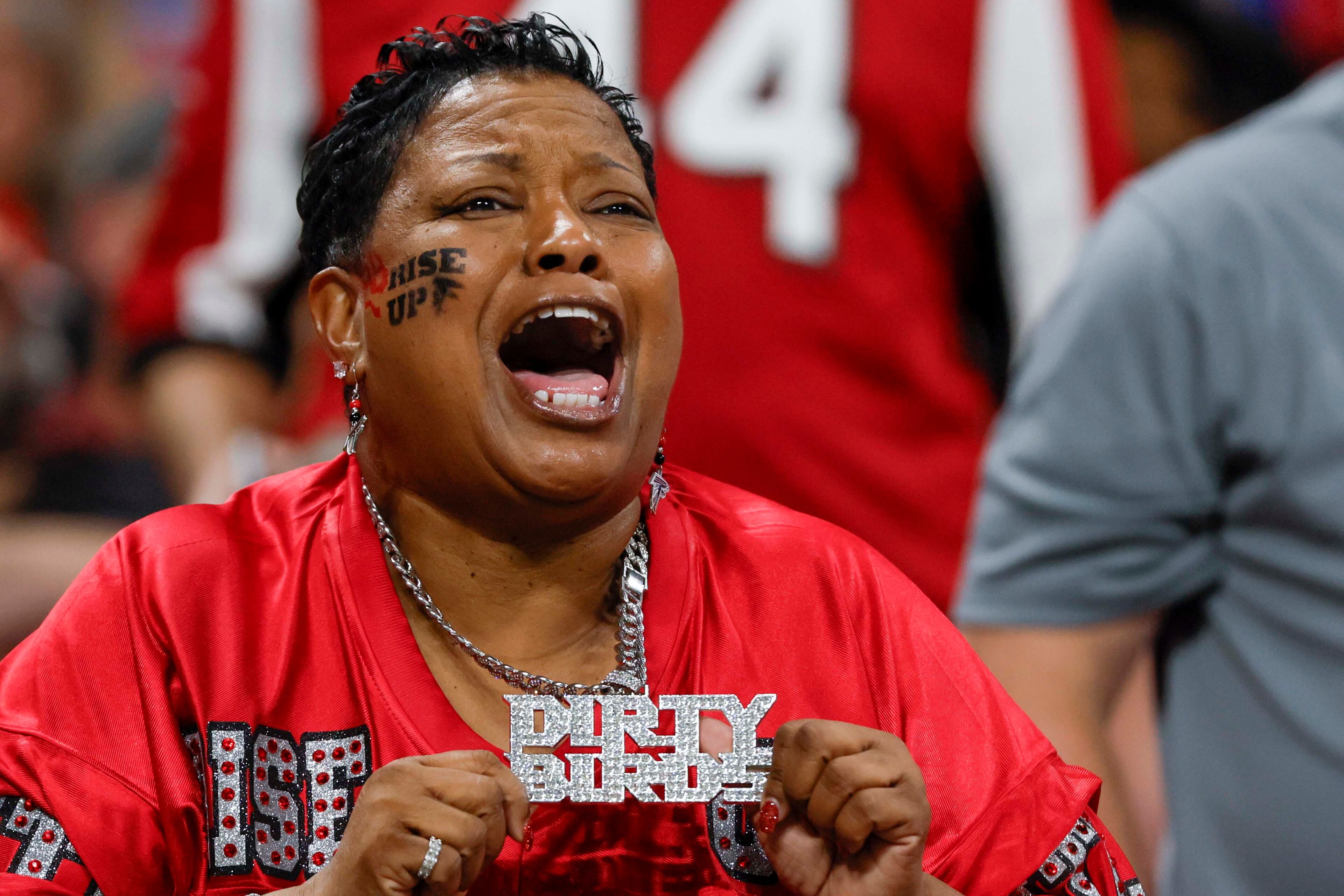Atlanta Falcons fan reacts after they score a touchdown during the first half of an NFL football game against the Buffalo Bills at Mercedes-Benz Stadium in Atlanta on Monday, October 13, 2025.
(Miguel Martinez/ AJC)