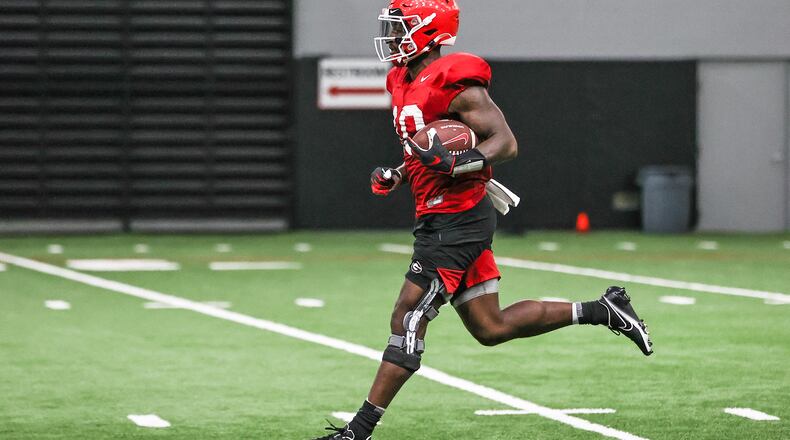 The ability of Georgia wide receiver Kearis Jackson (10), running in practice on Monday, to recover from an arthroscopic procedure on his right knee (note brace) will be paramount to the Bulldogs' passing game against Clemson in the season opener on Sept. 4 in Charlotte. (Photo by Mackenzie Miles/UGA Athletics)
