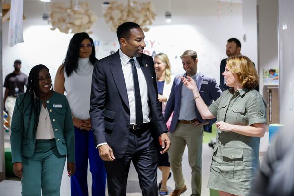 YMCA President and CEO Lauren Koontz, right, explains to Atlanta Mayor Andre Dicken all the programs run at the Arthur M. Blank Early Learning Center during a tour at a celebration of the 60th anniversary of the federal Head Start program on Monday, May 19, 2025. (Miguel Martinez/ AJC)