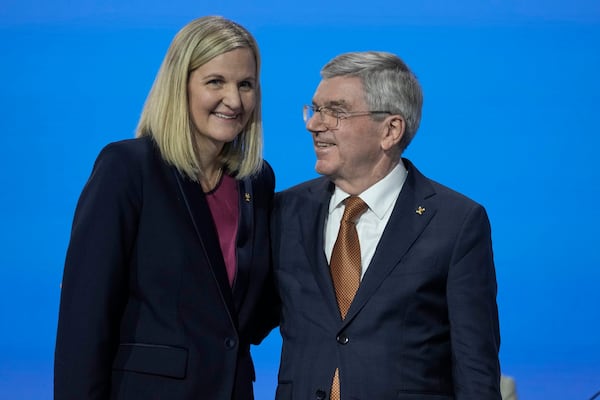 FILE - IOC President Thomas Bach, right, greets Kirsty Coventry after she was announced as the new IOC President at the International Olympic Committee 144th session in Costa Navarino, western Greece, Thursday, March 20, 2025. (AP Photo/Thanassis Stavrakis, File)
