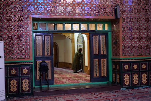 A Kashmiri Muslim man prays inside the shrine of Sheikh Abdul Qadir Jeelani, commonly known as Dastageer Sahib, in Srinagar, Indian controlled Kashmir, Wednesday, April 2, 2025. (AP Photo/Mukhtar Khan)