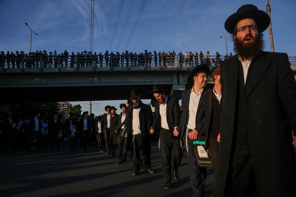 FILE - Ultra-Orthodox Jewish men block a highway during a protest against army recruitment in Bnei Brak, Israel, on March 2, 2025. (AP Photo/Ohad Zwigenberg, File)