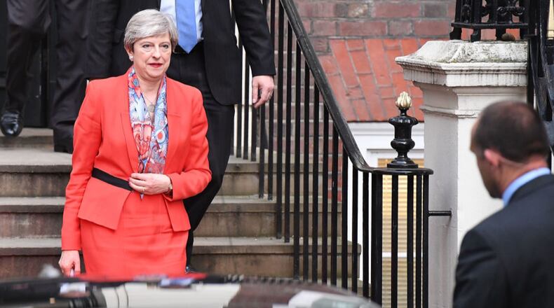 British Prime Minister Theresa May leaves Conservative Party headquarters on Friday.