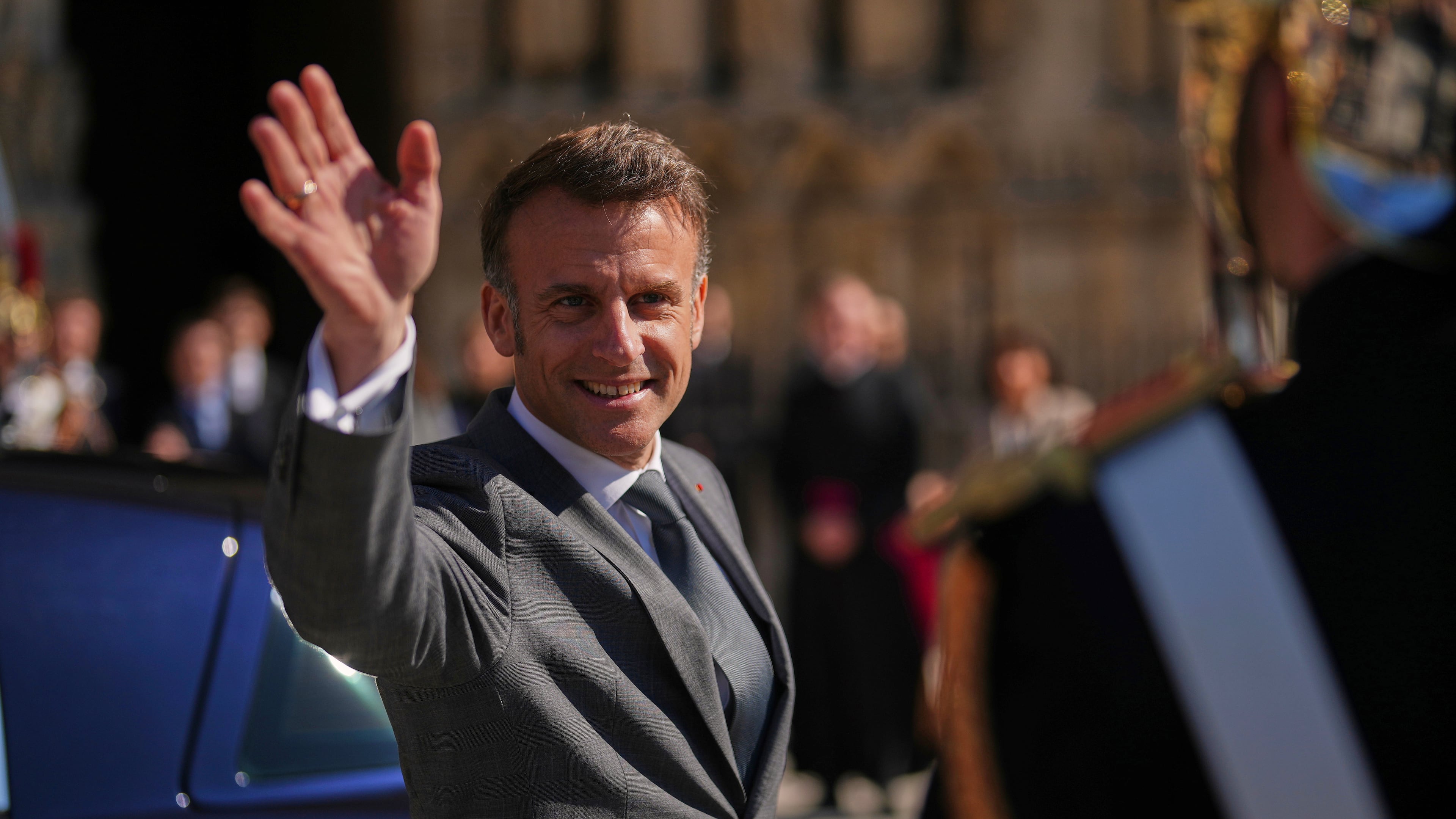 FILE - French President Emmanuel Macron waves after visiting Notre Dame cathedral with King Frederik X of Denmark and Queen Mary of Denmark, Wednesday, April 2, 2025 in Paris. (AP Photo/Thibault Camus, File)