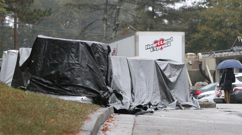 Construction materials are covered with tarps at DeKalb County’s Dresden Elementary School on Monday, Nov. 12, 2018, in Chamblee. The school district has several public meetings scheduled, beginning today, laying out its case for possibly seek up to $265 million in additional funds for construction cost increases and additional capital projects. CURTIS COMPTON/CCOMPTON@AJC.COM