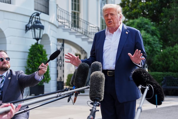 President Donald Trump speaks with reporters before departing the White House, Friday, July 11, 2025, in Washington. (AP Photo/Evan Vucci)