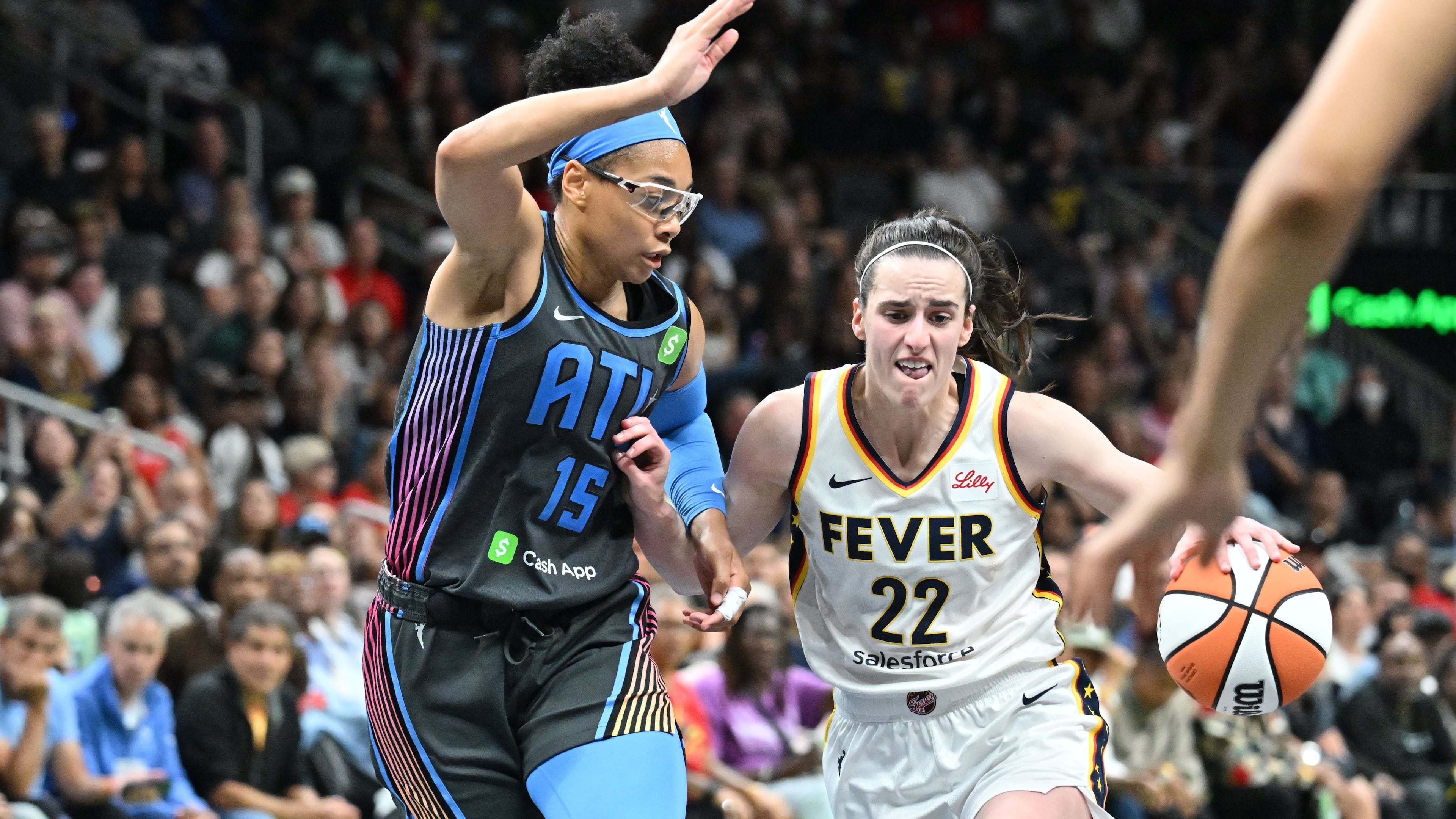 Indiana Fever guard Caitlin Clark (right) drives against Atlanta Dream guard Allisha Gray during the second half of Atlanta Dream’s home opener at State Farm Arena, Thursday, May 22, 2025, in Atlanta. Indiana Fever won 81-76 over Atlanta Dream. Clark has an injury and won’t return for the playoffs.(Hyosub Shin/ AJC)