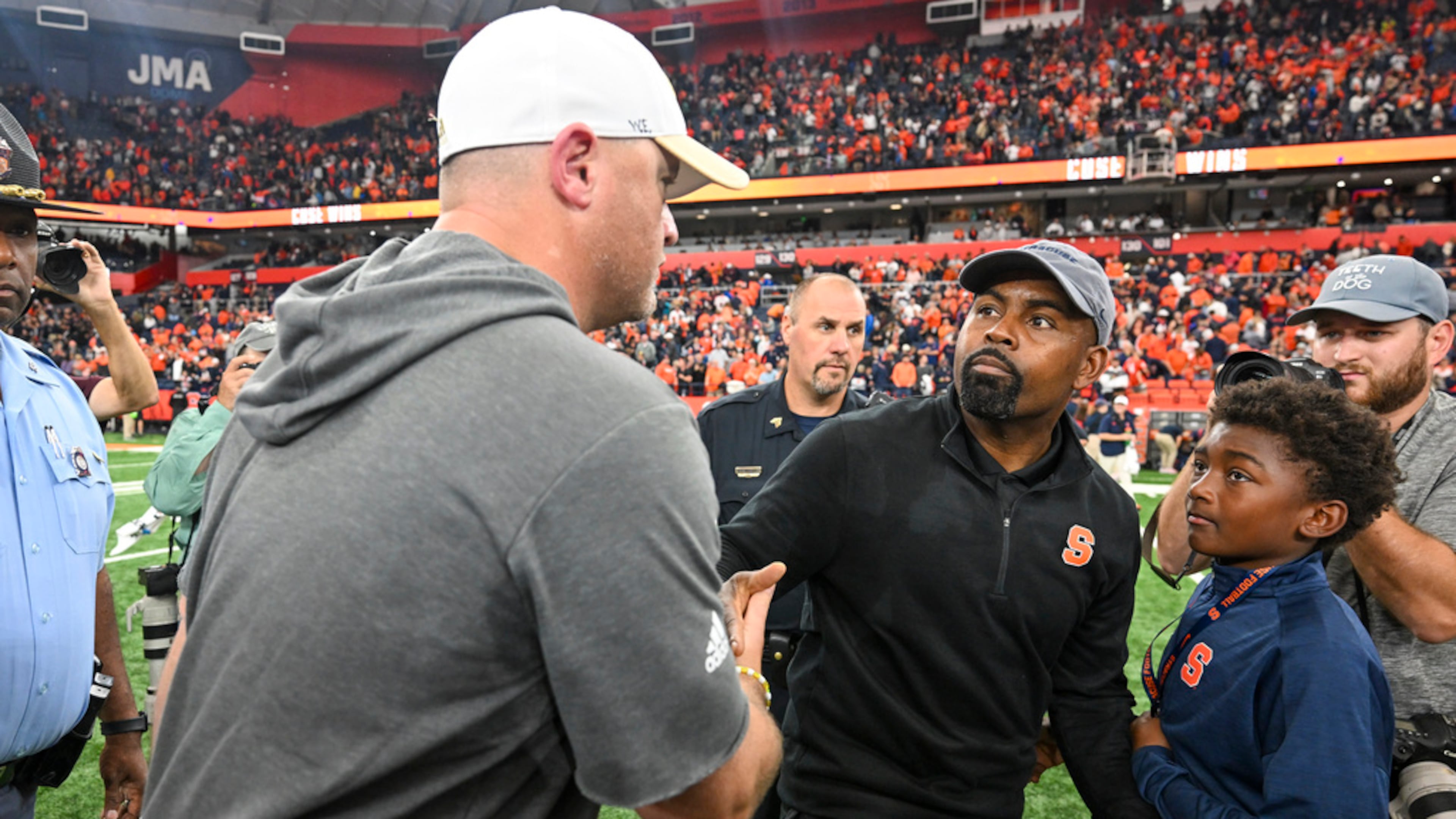 Georgia Tech head coach Brent Key (left) congratulates Syracuse head coach Fran Brown after after the Orange beat the Yellow Jackets on Sept. 7, 2024. (Hans Pennink/AP)