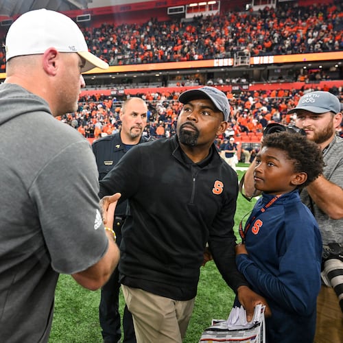 Georgia Tech head coach Brent Key (left) congratulates Syracuse head coach Fran Brown after after the Orange beat the Yellow Jackets on Sept. 7, 2024. (Hans Pennink/AP)