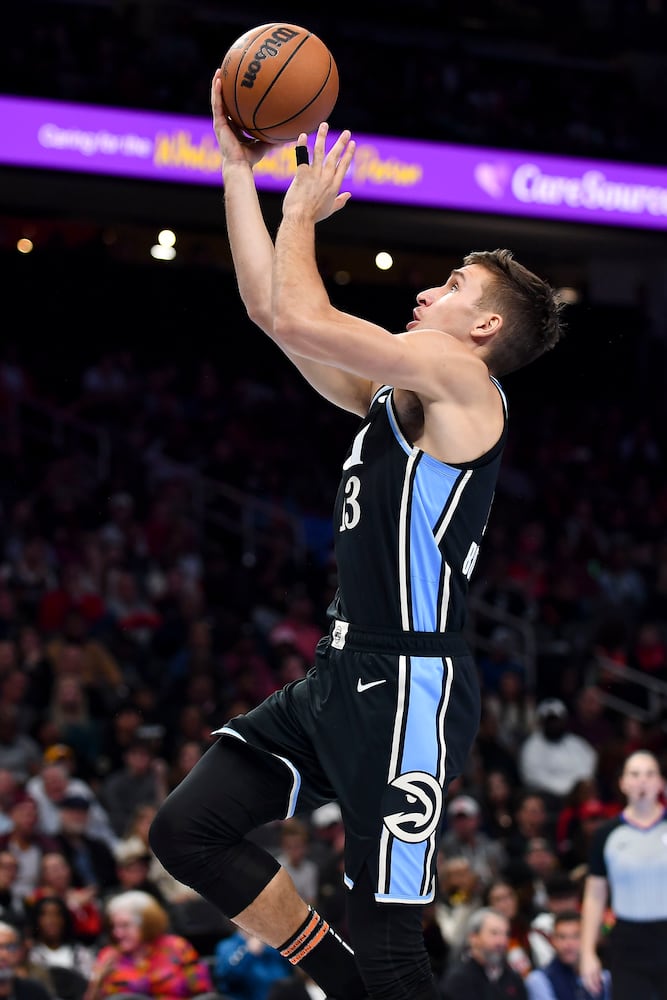 Atlanta Hawks guard Bogdan Bogdanovic (13) drives to the basket for a lay up against the Indiana Pacers during the second half of an NBA game Tuesday, November 21, 2023. (Daniel Varnado/For the AJC)
