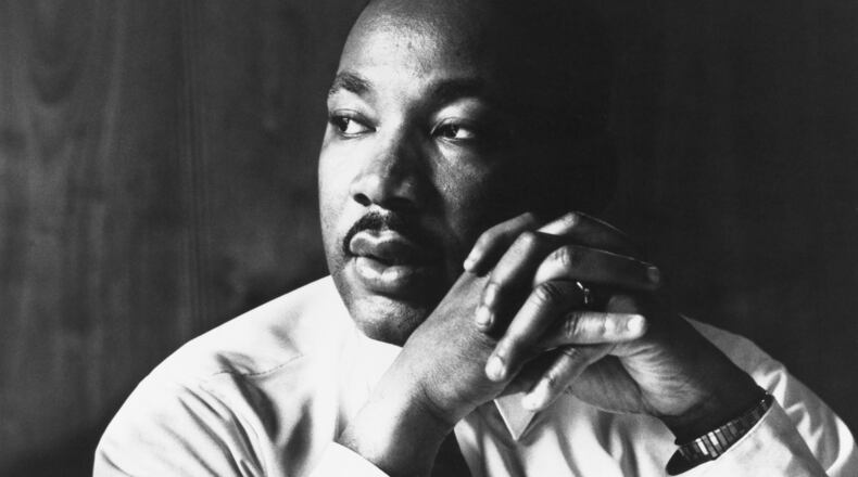 Martin Luther King Jr. listens to other staff members of SCLC during a meeting at an Atlanta restaurant. (Photo by © Flip Schulke/CORBIS/Corbis via Getty Images)