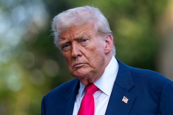 President Donald Trump walks from Marine One after arriving on the South Lawn of the White House, Tuesday, July 15, 2025, in Washington. (AP Photo/Alex Brandon)