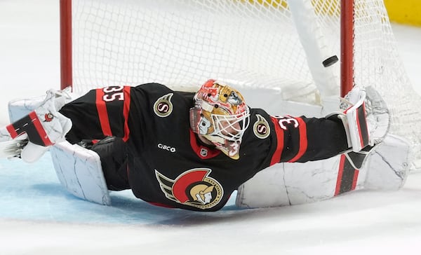 Ottawa Senators goaltender Linus Ullmark (35) keeps the puck out of the net during third period NHL playoff action in Ottawa, on Saturday, April 26, 2025. (Adrian Wyld/The Canadian Press via AP)