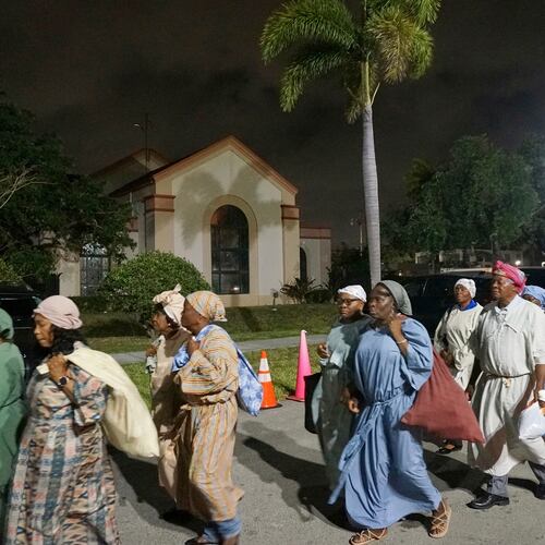 FILE - Parishioners of Notre Dame d'Haiti process outside the Catholic church during a Lent faith event that reenacted the biblical story of the Red Sea passage March 29, 2025, in Miami. (AP Photo/Giovanna Dell'Orto, File)
