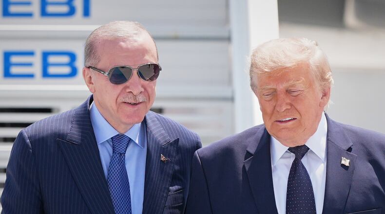 President Donald Trump walks with Turkish President Recep Tayyip Erdogan, left, upon arriving for the NATO summit in Ankara, Turkey, Tuesday, July 7, 2026. (AP Photo/Alex Brandon)