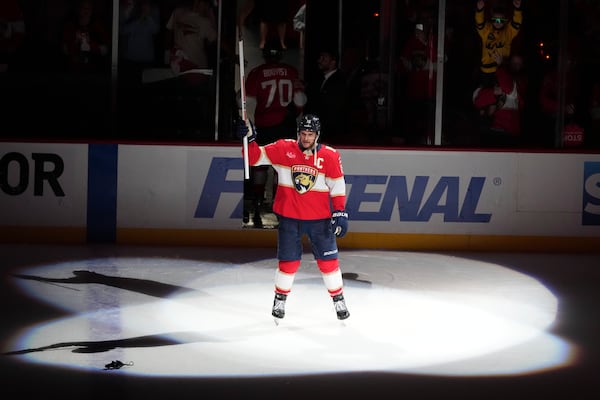 Florida Panthers center Aleksander Barkov acknowledges the crowd while being named the second player of the game after the Panthers defeated the Carolina Hurricanes in Game 3 of the NHL hockey Stanley Cup Eastern Conference finals Saturday, May 24, 2025, in Sunrise, Fla. (AP Photo/Lynne Sladky)