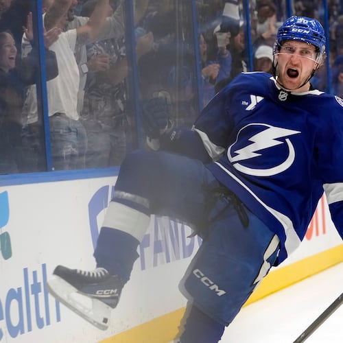 Tampa Bay Lightning defenseman J.J. Moser (90) celebrates after scoring the game-winning goal against the Montréal Canadiens during overtime in Game 2 of an NHL hockey Stanley Cup first-round playoff series, Tuesday, April 21, 2026, in Tampa, Fla. (AP Photo/Chris O'Meara)