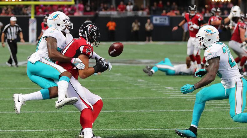 Dolphins cornerback Cordrea Tankersley knocks the ball away from Falcons tight end Austin Hooper and into the arms of Dolphins safety Reshad Jones in the final minute of the Falcons' 20-17 loss at home Oct. 15. Curtis Compton/ccompton@ajc.com.