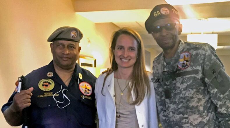 Senior Staff Attorney Carlissa Carson (center) is with two of the veterans receiving assistance from the Emory Law Volunteer Clinic for Veterans. (Courtesy of Emory University)