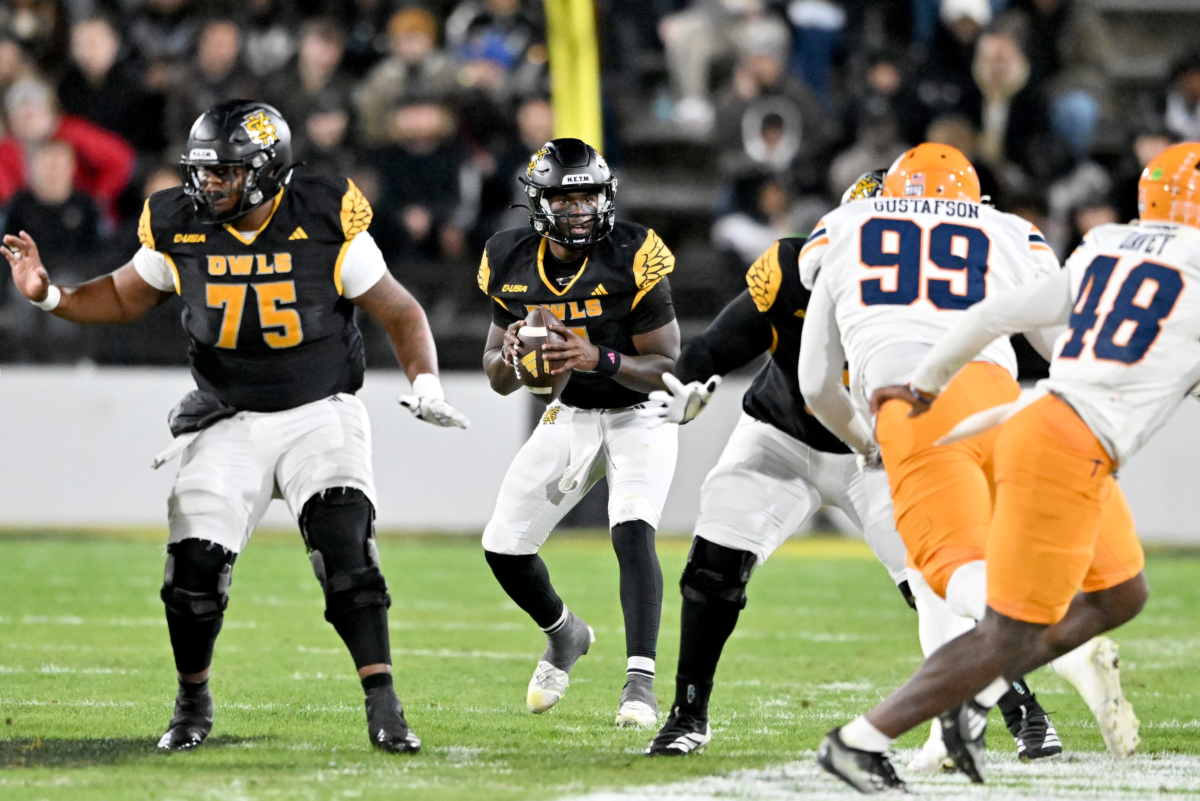 Kennesaw State quarterback Dexter Williams II (5) prepares to get off a pass during the first half in an NCAA college football game at Fifth Third Stadium, Tuesday, October 28, 2025 in Kennesaw. (Hyosub Shin / AJC)