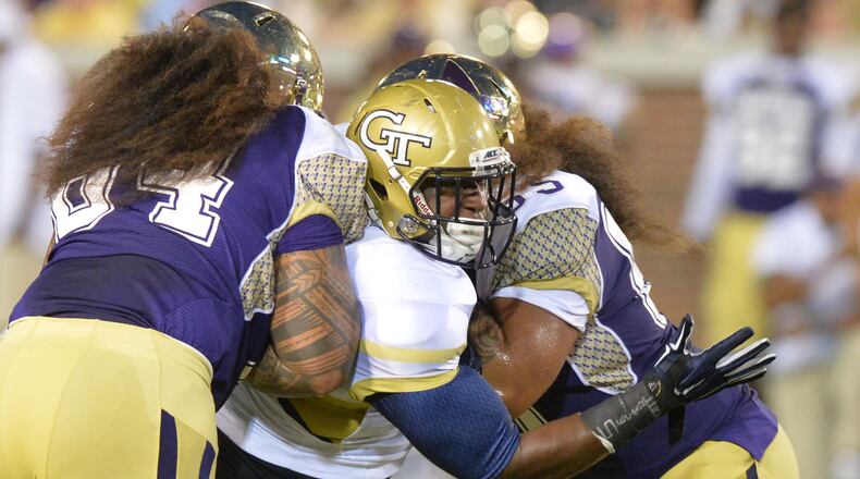 Georgia Tech Yellow Jackets defensive lineman Jabari Hunt (32) gets double coverage by Alcorn State Braves wide receiver Jalen Walker (left) and Alcorn State Braves offensive lineman Toto'a Leilua (right) in the first half of the Georgia Tech season opener against the Alcorn State Braves in Bobby Dodd Stadium on Thursday, September 3, 2015. HYOSUB SHIN / HSHIN@AJC.COM