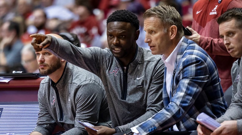 Alabama assistant coach Antoine Pettway talks with Alabama head coach Nate Oats during the second half of an NCAA college basketball game against Longwood, Monday, Nov. 7, 2022, in Tuscaloosa, Ala. (AP Photo/Vasha Hunt)