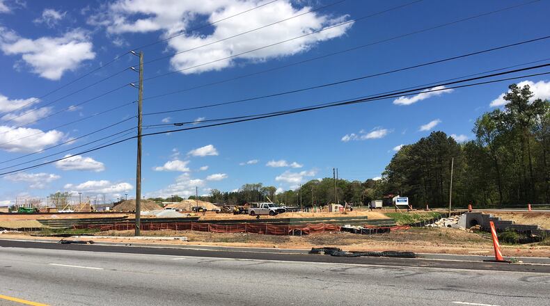 The site near Ga. 124 and Pharrs Road in Snellville is a very busy place these days. TYLER ESTEP / TYLER.ESTEP@COXINC.COM