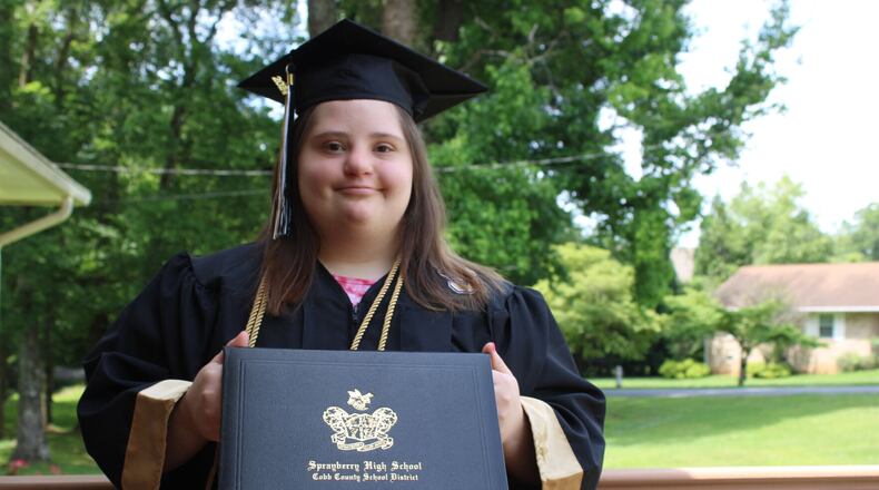 Ashlynn Rich, above, and five other Sprayberry students with disabilities were placed behind the stage during the 2024 graduation ceremony, unable to enjoy the festivities alongside their general education peers or see any of the speakers.