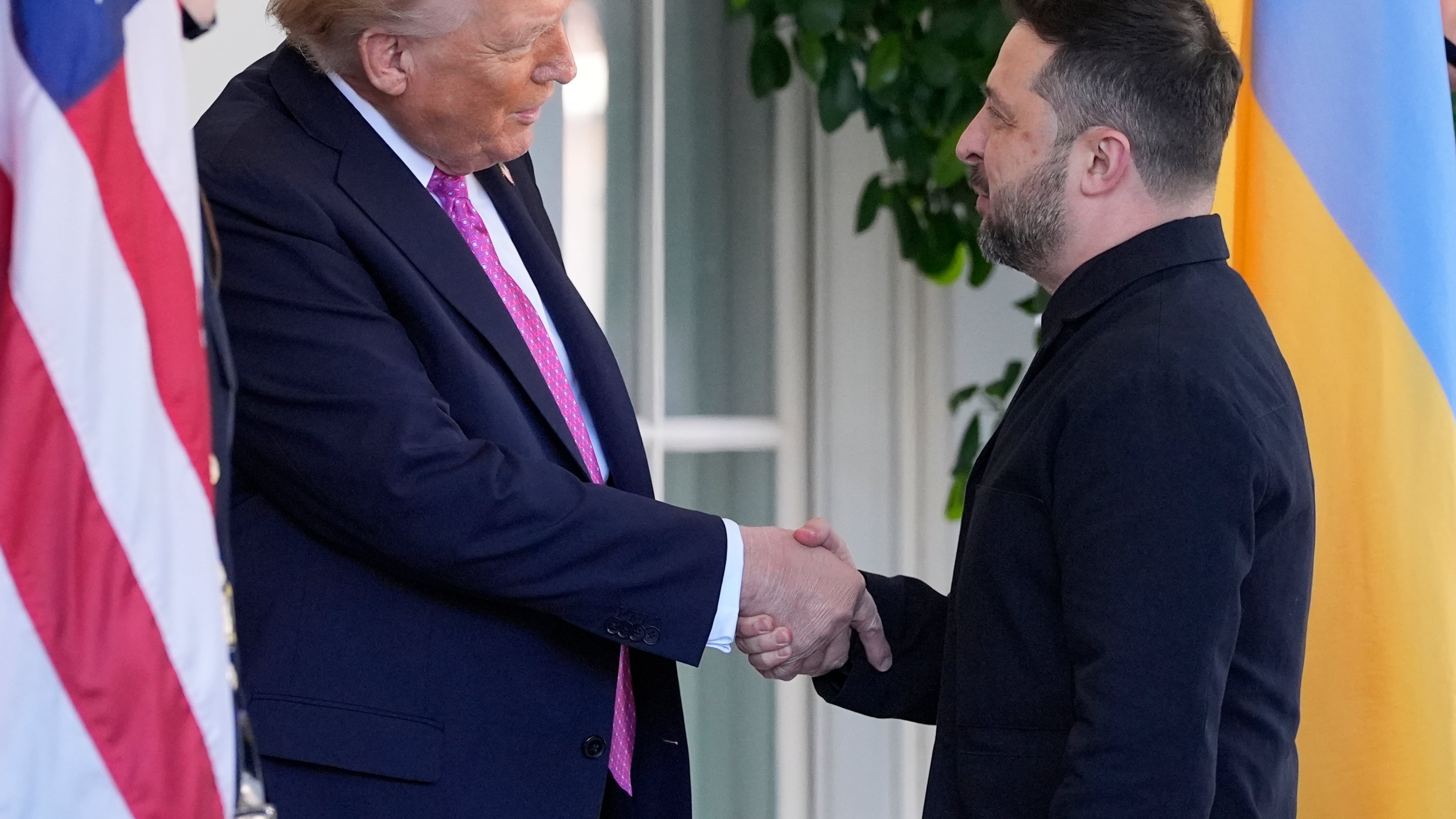 President Donald Trump, left, greets Ukraine's President Volodymyr Zelenskyy at the White House, Friday, Oct. 17, 2025, in Washington. (AP Photo/Alex Brandon)