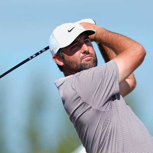 FILE - Scottie Scheffler, of the United States, watches his tee-off at the fourth hole during the final round of the Hero World Challenge PGA Tour at the Albany Golf Club in New Providence, Bahamas, Dec. 7, 2025. (AP Photo/Fernando Llano, File)