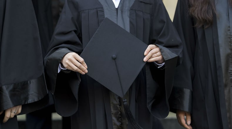 Graduates in gown and caps celebrate their graduation at the HHL Leipzig Graduate School of Management on August 30, 2014, in Leipzig, Germany.