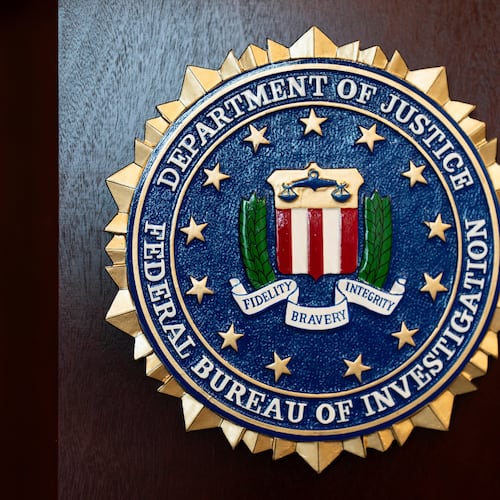 FILE - An FBI seal is displayed on a podium before a news conference at the field office in Portland, Ore., Jan. 16, 2025. (AP Photo/Jenny Kane, File)