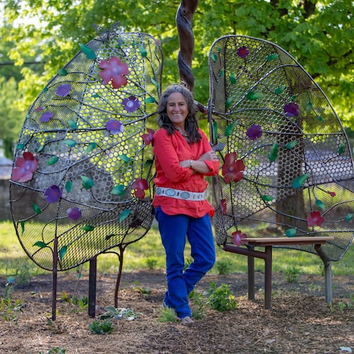 Shannon Willow stands with her sculpture, Lungs of Mother Earth, at a pocket park in Scottdale. The public art is an early element of the Compassion Corridor, a path stretching from Decatur to Stone Mountain. (Courtesy of Isadora Pennington)