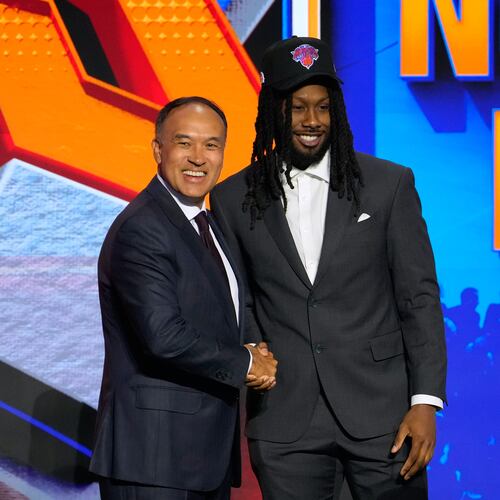 Bruce Thornton poses for a photo with NBA Deputy Commissioner Mark Tatum after being selected by the New York Knicks in the second round of the NBA basketball draft Wednesday, June 24, 2026, in New York. (AP Photo/Yuki Iwamura)