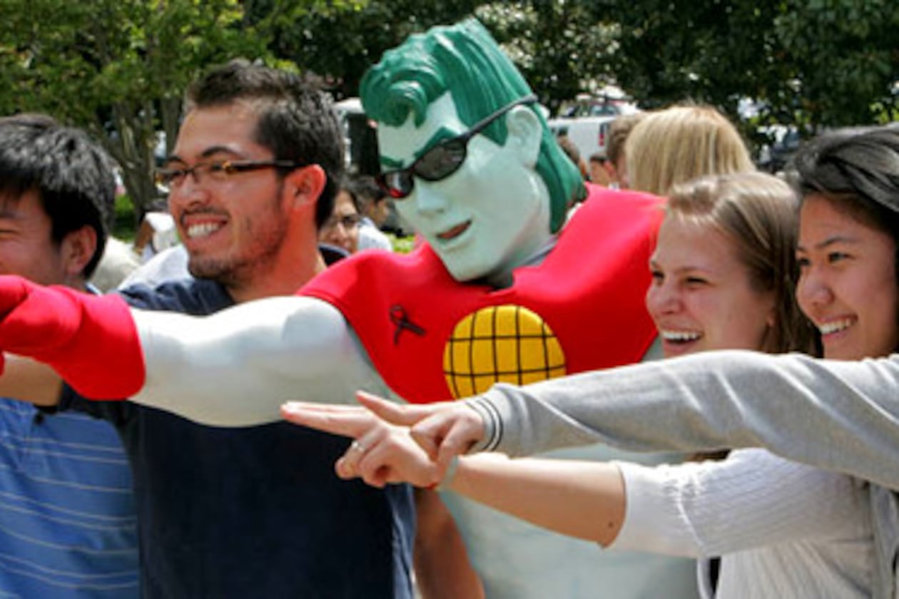 Georgia Tech students (from left) Bob Chen, J.P Aragon, Katy Roege and Lisa Pan pose with their Earth Day hero, Captain Planet (middle) at 10th Annual Georgia Tech Earth Day celebration on April 20, 2007. (John Spink/AJC file)